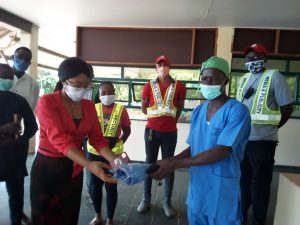 Gov's Rep handing over the materials to Doctors